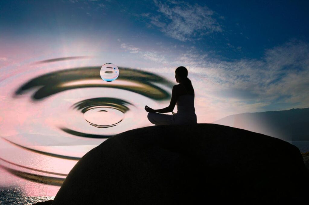 woman meditates on a hill and manifests a vision