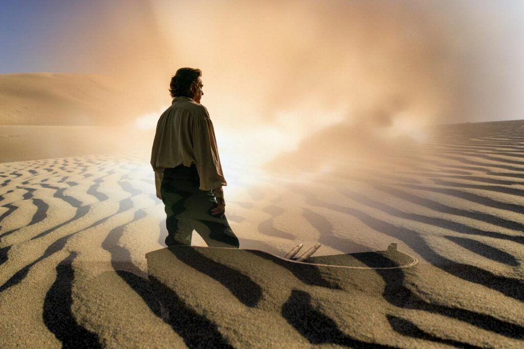 Man with boat superimposed on the desert
